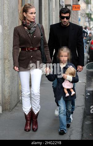 Luis Figo with daughter and wife Helen Svedin shopping in Milan. Stock Photo