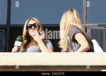 Carmen Electra on the TV show TRL (Total Request Live) being filmed on the balcony of Duomo square, Milan. Stock Photo