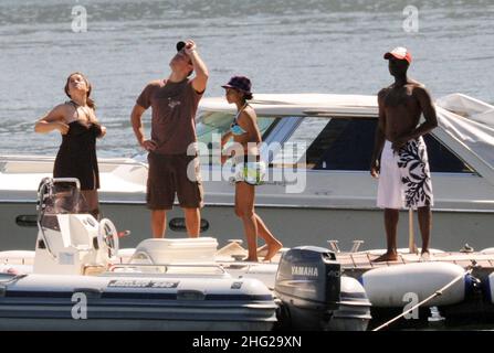 Matt Damon with wife and daughter and fellow Ocean's Eleven actor Don Cheadle on holiday as guests at George Clooney's villa in Laglio, Lake Como, Italy. Stock Photo