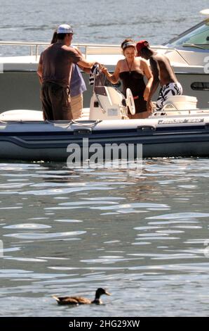 Matt Damon with wife and daughter and fellow Ocean's Eleven actor Don Cheadle on holiday as guests at George Clooney's villa in Laglio, Lake Como, Italy. Stock Photo