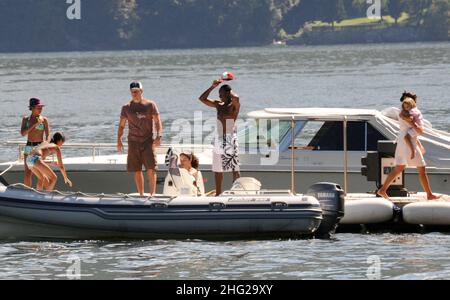 Matt Damon with wife and daughter and fellow Ocean's Eleven actor Don Cheadle on holiday as guests at George Clooney's villa in Laglio, Lake Como, Italy. Stock Photo