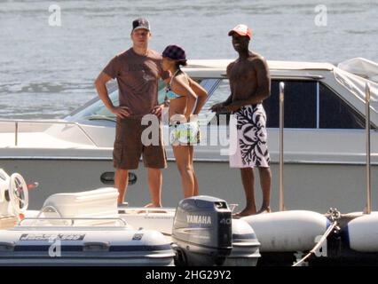 Matt Damon with wife and daughter and fellow Ocean's Eleven actor Don Cheadle on holiday as guests at George Clooney's villa in Laglio, Lake Como, Italy. Stock Photo