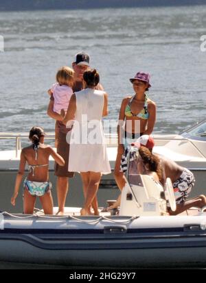 Matt Damon with wife and daughter and fellow Ocean's Eleven actor Don Cheadle on holiday as guests at George Clooney's villa in Laglio, Lake Como, Italy. Stock Photo