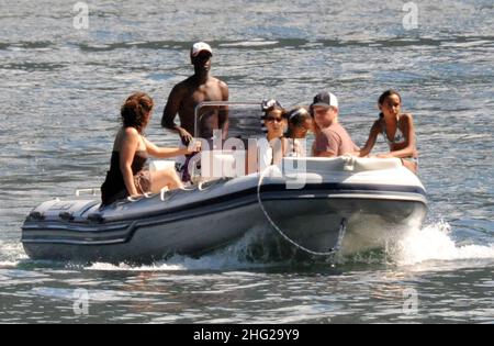 Matt Damon with wife and daughter and fellow Ocean's Eleven actor Don Cheadle on holiday as guests at George Clooney's villa in Laglio, Lake Como, Italy. Stock Photo