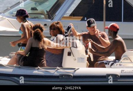 Matt Damon with wife and daughter and fellow Ocean's Eleven actor Don Cheadle on holiday as guests at George Clooney's villa in Laglio, Lake Como, Italy. Stock Photo