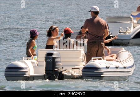 Matt Damon with wife and daughter and fellow Ocean's Eleven actor Don Cheadle on holiday as guests at George Clooney's villa in Laglio, Lake Como, Italy. Stock Photo