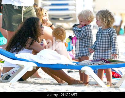 Businessman Marco Tronchetti Provera and his wife Afef Jnifen meet friends at the beach, Spain Stock Photo