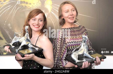 Polish-born Dutch director Urszula Antoniak, right, holds the Leopard for the best first feature of the Filmmakers of the Present Competition she received for her movie 'Nothing Personal', and Dutch actress Lotte Verbeek, left, holds the Leopard for best actress she received for her role in the movie 'Nothing Personal', during a photocall at the 62nd Locarno International Film Festival Stock Photo