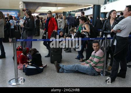 European airports are still at a stand still caused by Icelandic volcano Eyjafjollajokull. Passengers waiting in Rome Fiumicino airport, Rome Stock Photo