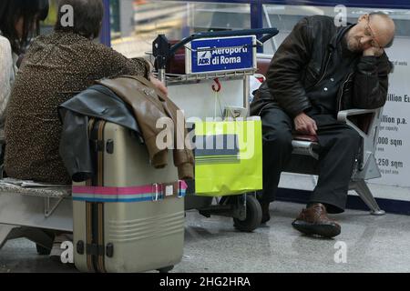 European airports are still at a stand still caused by Icelandic volcano Eyjafjollajokull. Passengers waiting in Rome Fiumicino airport, Rome Stock Photo