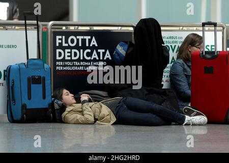 European airports are still at a stand still caused by Icelandic volcano Eyjafjollajokull. Passengers waiting in Rome Fiumicino airport, Rome Stock Photo