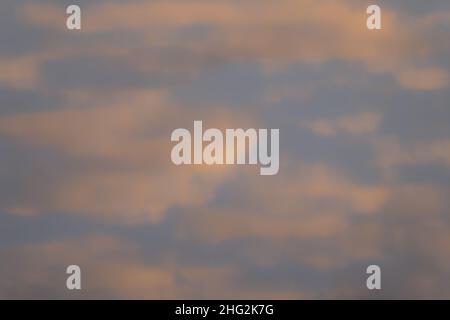 Background Texture. Scattered Clouds Reflections in Warm Light. Stock Photo