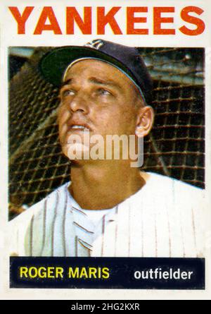 Roger Maris of the New York Yankees swings into the ball in the third  inning as he connects for his 59th home run of the season at Baltimore  Sept. 20, 1961. The