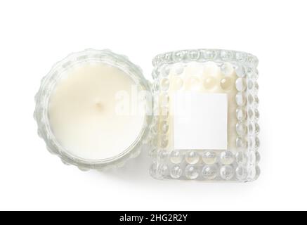 Beautiful wax candles in glass holders isolated on white background Stock Photo