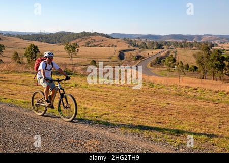 Cycling near Harlin on the Brisbane Valley Rail Trail Stock Photo