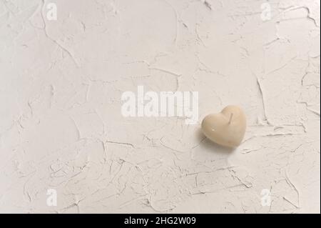 handmade candle in the shape of a heart. Stock Photo