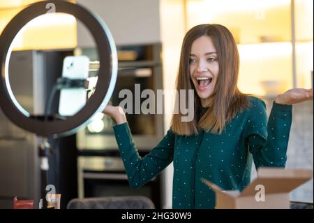 Cute young woman making a workshop on haircare Stock Photo