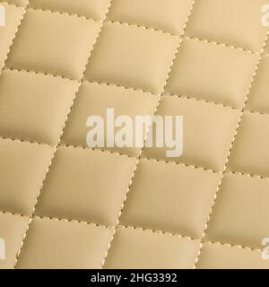Texture of beige leather background with square pattern and stitch, macro Stock Photo