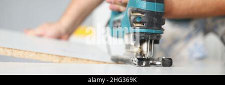 Man using tool for work Stock Photo
