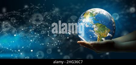 Businessman hand holding World Technology Connection with Abstract Background. Global Connected Concept. Elements furnished by NASA. Stock Photo