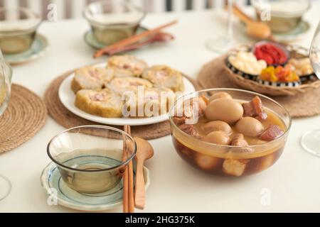 Bowl of traditional Vietnamese braised pork with eggs served for Tet family dinner Stock Photo