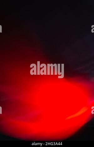Vertical black background with bright red glow waves and highlights. Abstract backdrop. Stock Photo