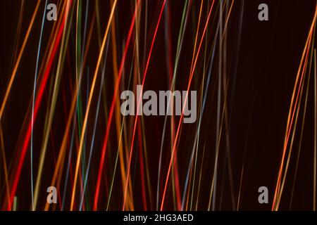 Bright multicolored diagonal and vertical lines of rays on. Abstract dark banner background. Backdrop. Space for text or message Stock Photo