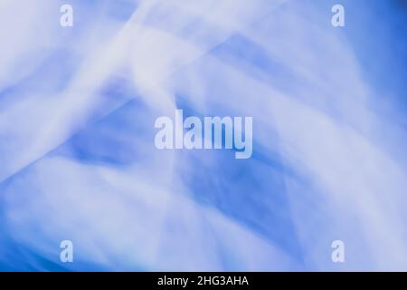 Horizontal blue white abstract background banner with light blur. Backdrop of waves of highlights and lines. Stock Photo