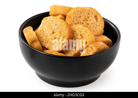 Olive and tomato bruschetta chips in a black ceramic bowl isolated on white. Stock Photo