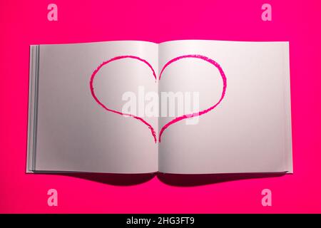Notebook with white blank pages for notes on pink background. Stock Photo