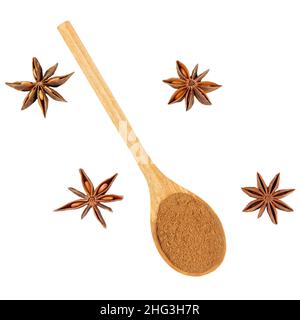 Whole and ground star anise in a wooden spoon isolated on a white background. Stock Photo
