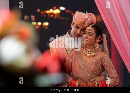 portrait of an indian wedding couple posing for album 2hg3hp0