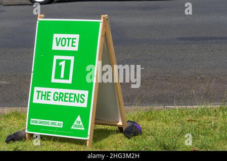 A political poster sandwich board placed on a footpath by the NSW Greens party for voting in November 2021 local council elections Stock Photo