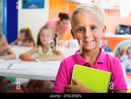 Boy pupil standing in elementary school class Stock Photo