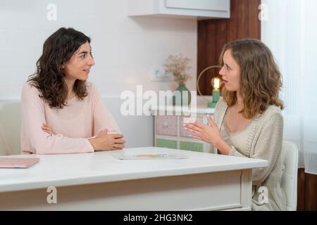 Conversation of two young women in a nutrition consultation Stock Photo