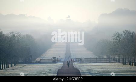 Runners and walkers make use of the Long Walk near Windsor Castle, Berkshire, as the country wakes up after a night when temperatures again dipped below freezing. Picture date: Tuesday January 18, 2022. Stock Photo