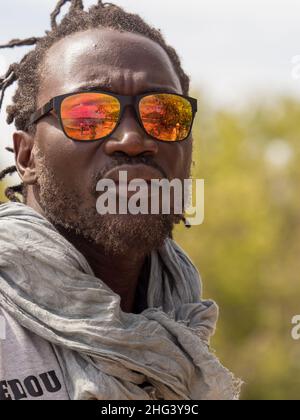 Senegal, Africa - January 24, 2019: Portrait of a black man in sunglasses. Stock Photo