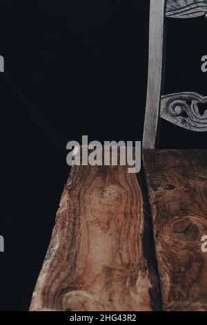 empty wooden table with smoke float up on dark background. Stock Photo
