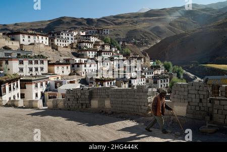 View of beautiful traditional Buddhist village with rows of houses built on terraced Himalayan slopes in Kibber, India. Stock Photo