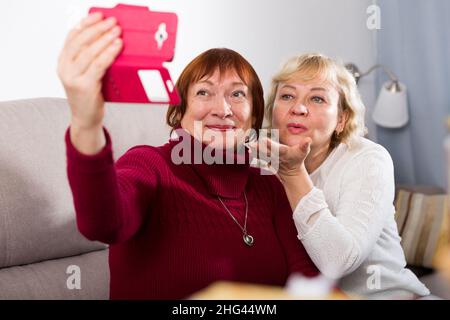 Mature female friends making selfie Stock Photo