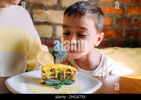 Mom and son are having fun and celebrating children's birthday.  Stock Photo