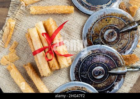 semprong cake, or apit apit, sometimes also known as egg roll, a light snack made from a mixture of rice flour, flour, sugar, fresh coconut milk. Stock Photo