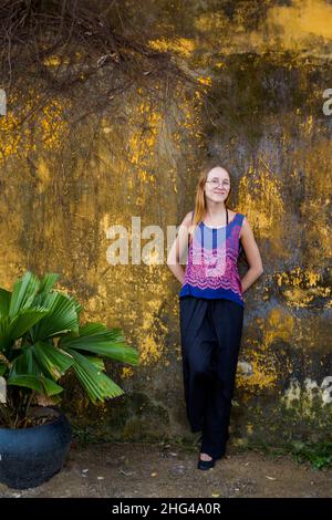 Beautiful tourist among oriental architecture of Vietnam taken in Hoi An Stock Photo