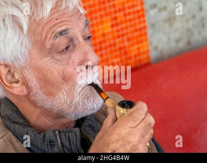 Man smoking a pipe Stock Photo