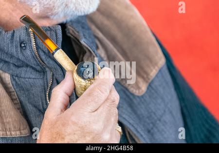 Man smoking a pipe Stock Photo