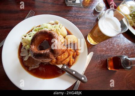 pub lunch of sunday roast beef including large yorkshire pudding, lake district, cumbria, england, uk Stock Photo