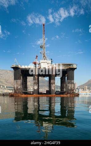 An oil extraction platform in Table Bay harbour, Cape Town, being repaired. Stock Photo