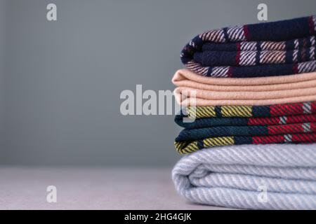 Stack of woolen checked blankets Stock Photo