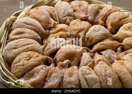 Traditional dried sweet Turkish figs in a basket close up Stock Photo