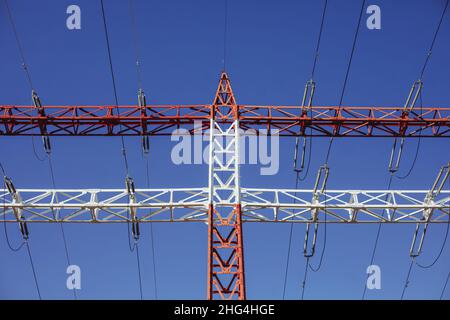 High voltage transmission lines on metallic poles in Bucharest, Romania. Stock Photo